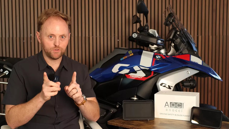 aoocci-collabs-_bigrockmoto-445k-1280 Man giving a thumbs-up gesture in front of a motorcycle and branded box.